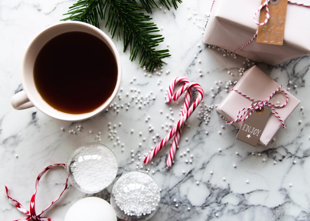 Coffee and candy canes on a winter background